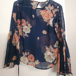 Sheer, floral, bell-sleeve shirt.